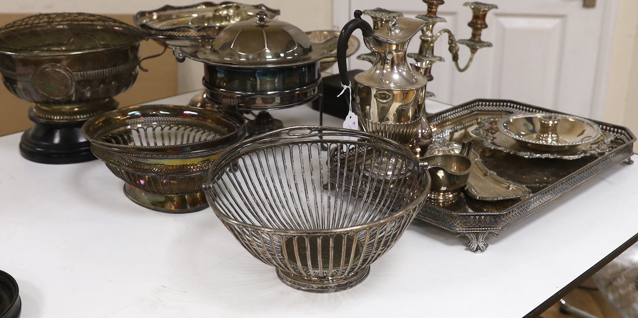 A quantity of mixed plate including a tray two baskets, candelabra , Tarzan etc